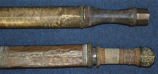 A Tibetan Dao or sword, largest 32.5in. incl. scabbard